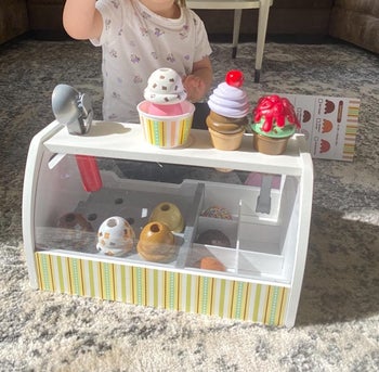 Reviewer's child playing with the ice cream counter