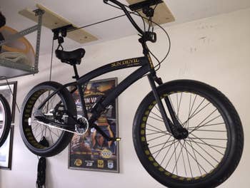 bike hanging from a garage ceiling