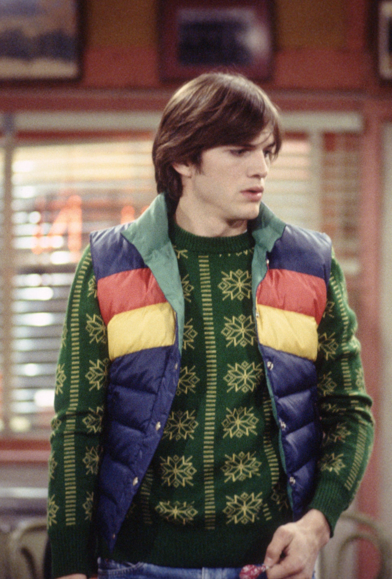 tri-color puffer vest over a sweater