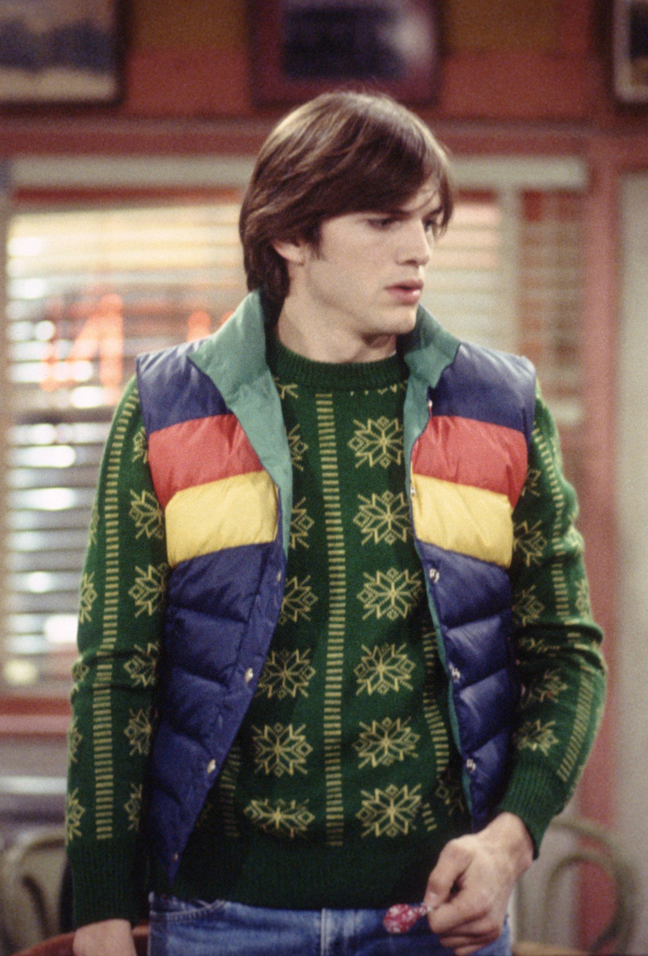 tri-color puffer vest over a sweater