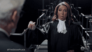 The Judge from The Good Place giving two thumbs down and blowing a raspberry