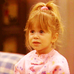 Gif of Full House character Michelle blowing a kiss