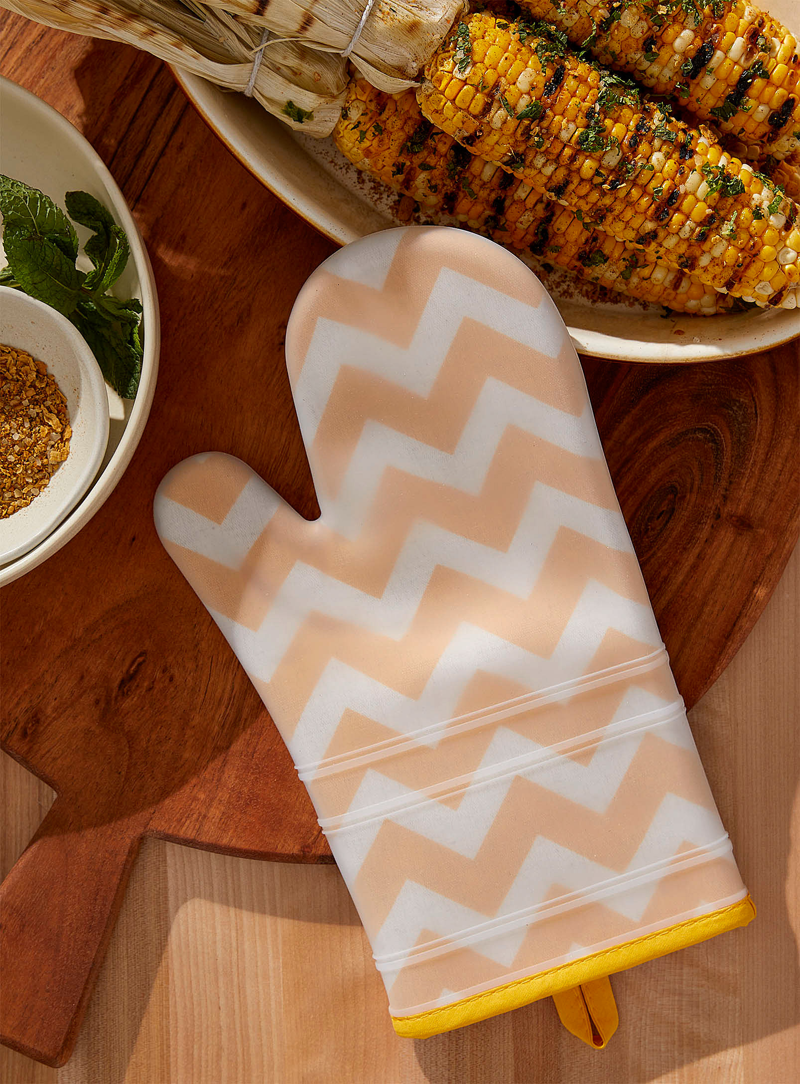 An oven mitt on a wooden table