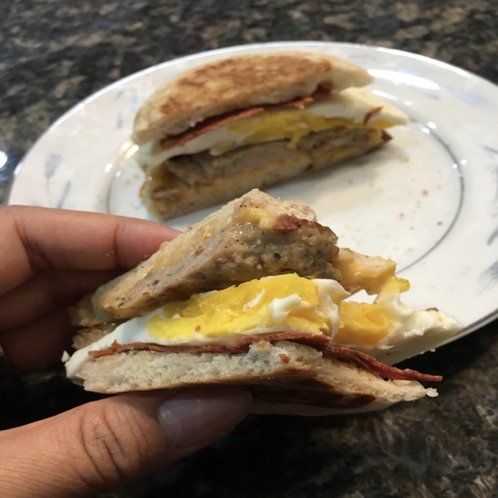 a reviewer photo of a perfectly cooked breakfast sandwich