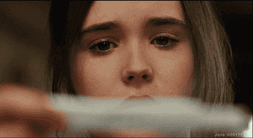 Gif of Juno looking at a pregnancy test