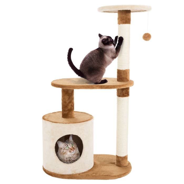 three-tier cat tree with scratching posts with two cats playing on it