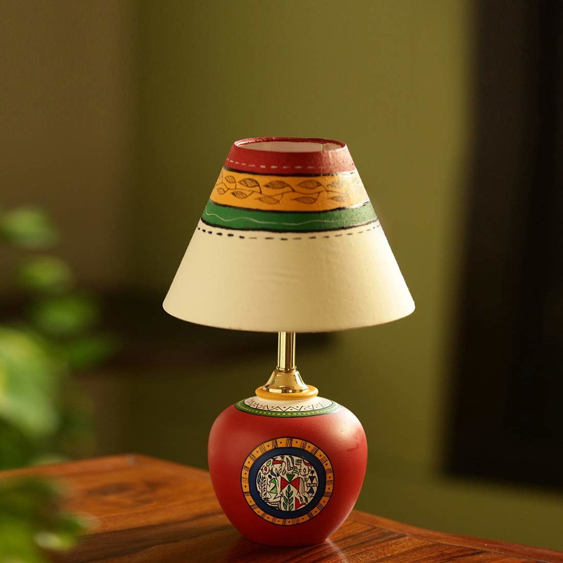 A Warli lamp on a table