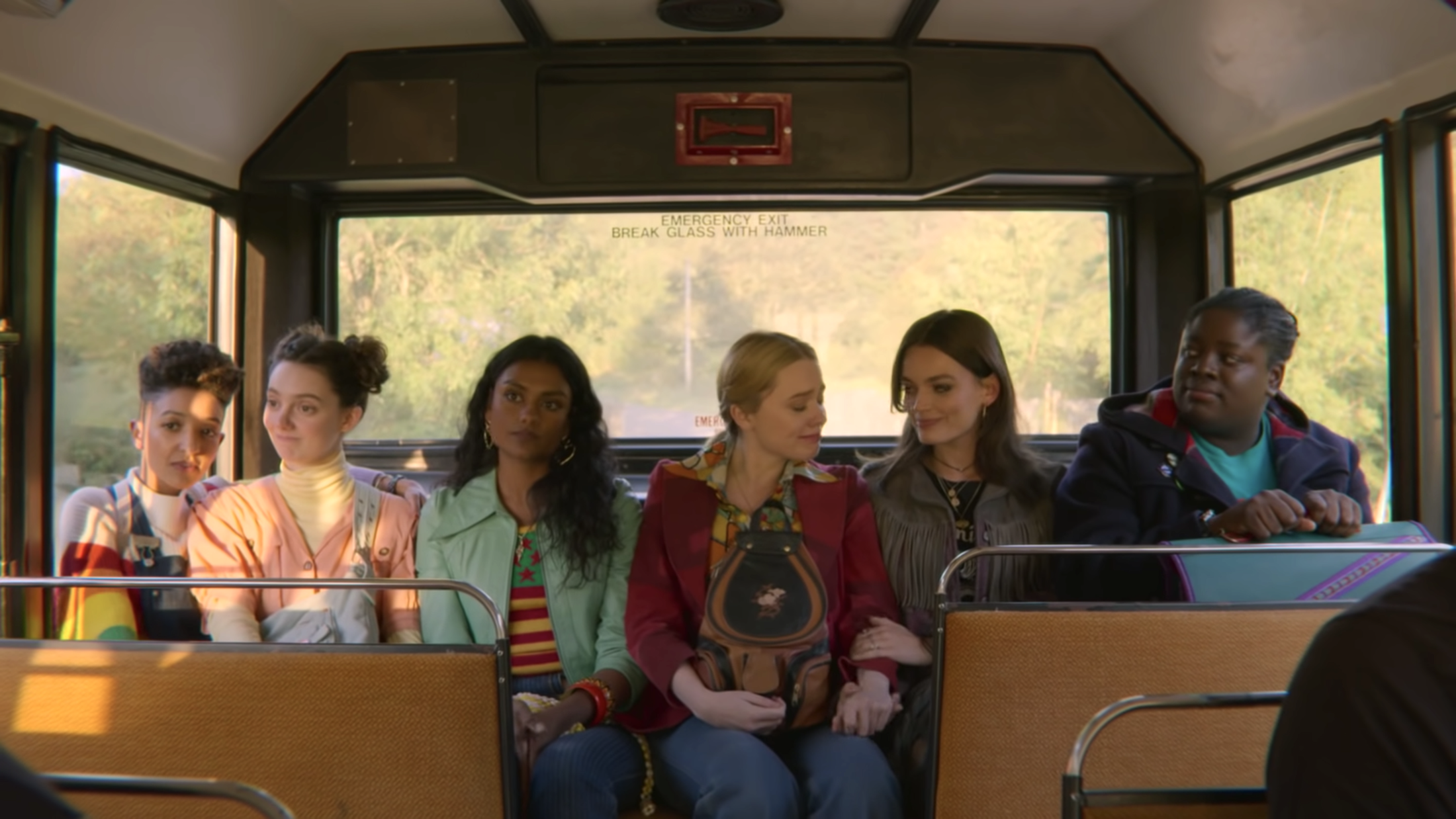 Six girls sitting on a bus