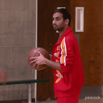 A man reacting to the basketball being taken from his hands