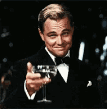 Leonardo DiCaprio toasting with a glass