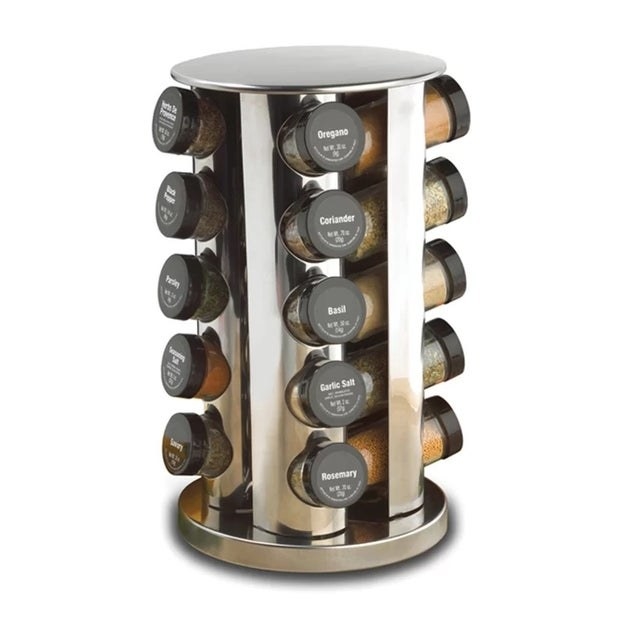 A silver rotating spice rack with spice jars