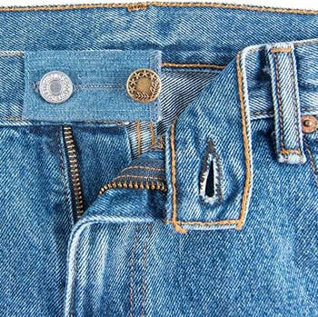 a pair of jeans with the waist extender installed