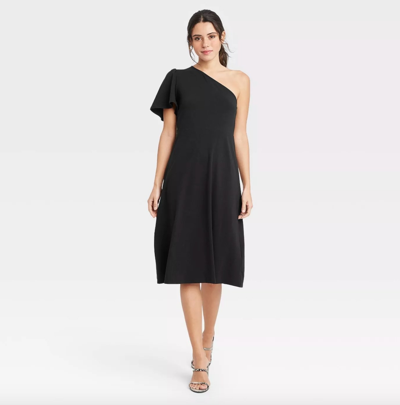 The stylish one-shoulder black dress