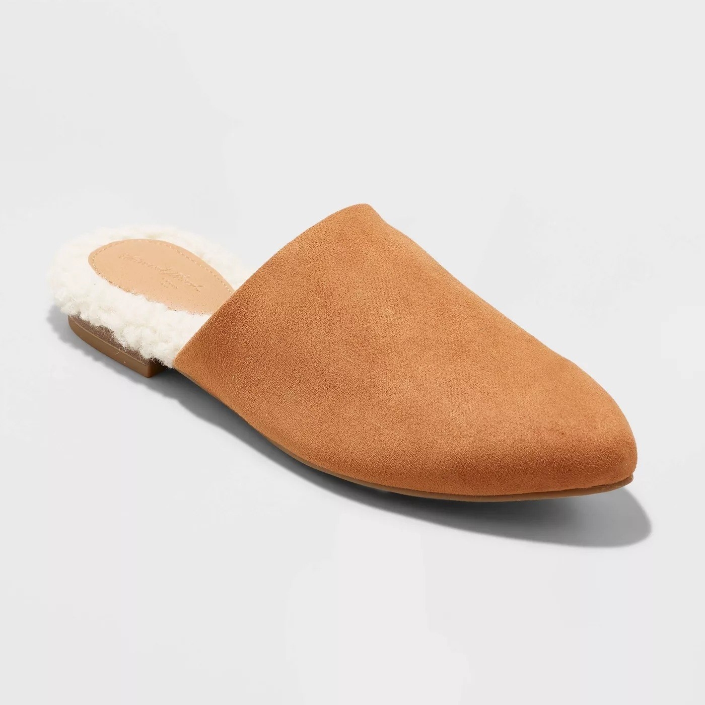 The camel colored mule, with white faux fur on the inside heel