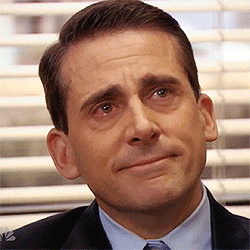 A gif of Michael Scott with teary eyes and smiling