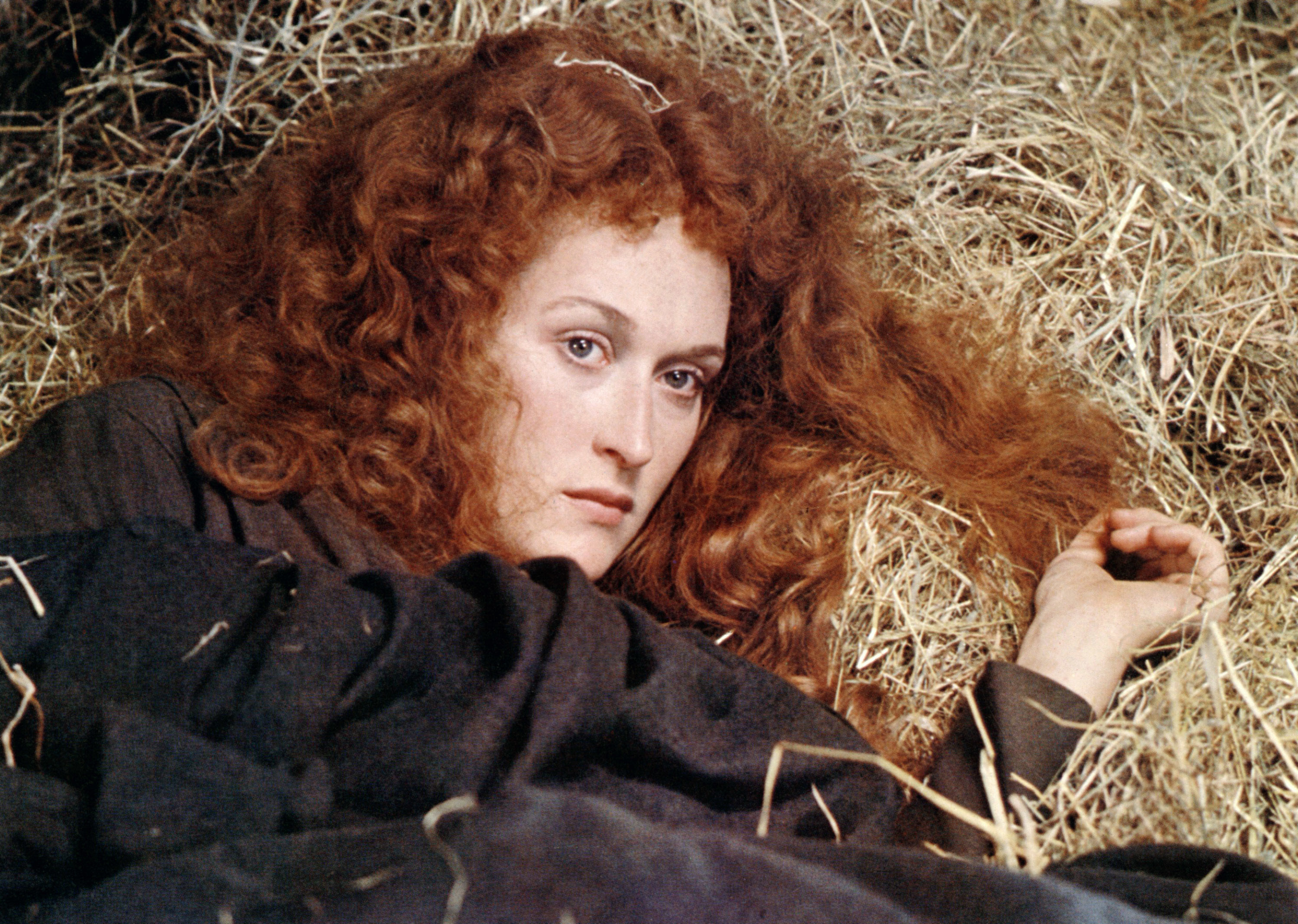 Streep lying on hay in the film