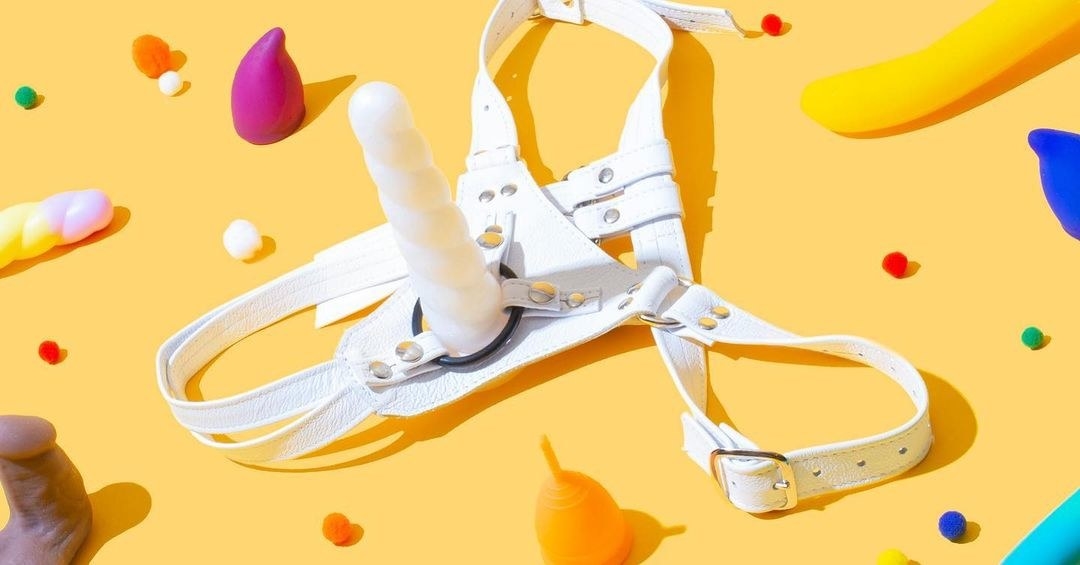 White unicorn horn dildo attached to strap-on