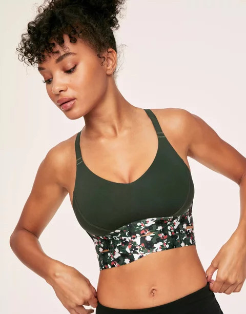 Model wearing strappy sports bra