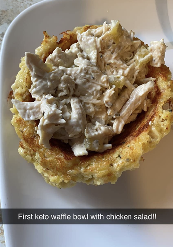 Reviewer image of a waffle bowl with chicken salad in it