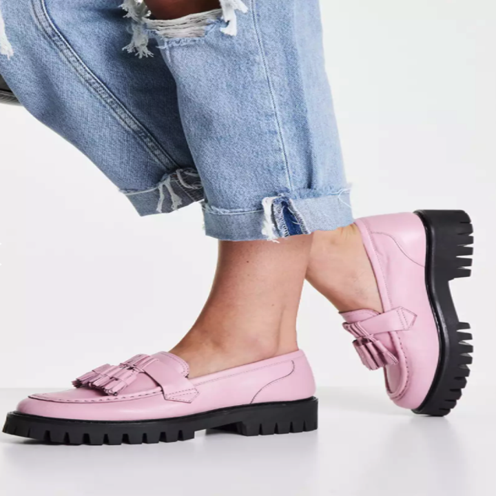 A model wearing the pink loafer
