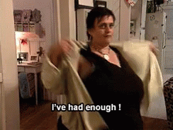 A woman saying &quot;I&#x27;ve had enough!&quot; as she takes off her jacket