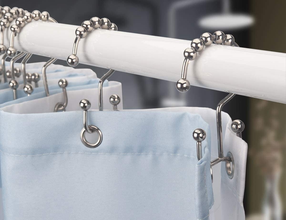 the double-sided hooks with a shower curtain on one side and a liner on the other