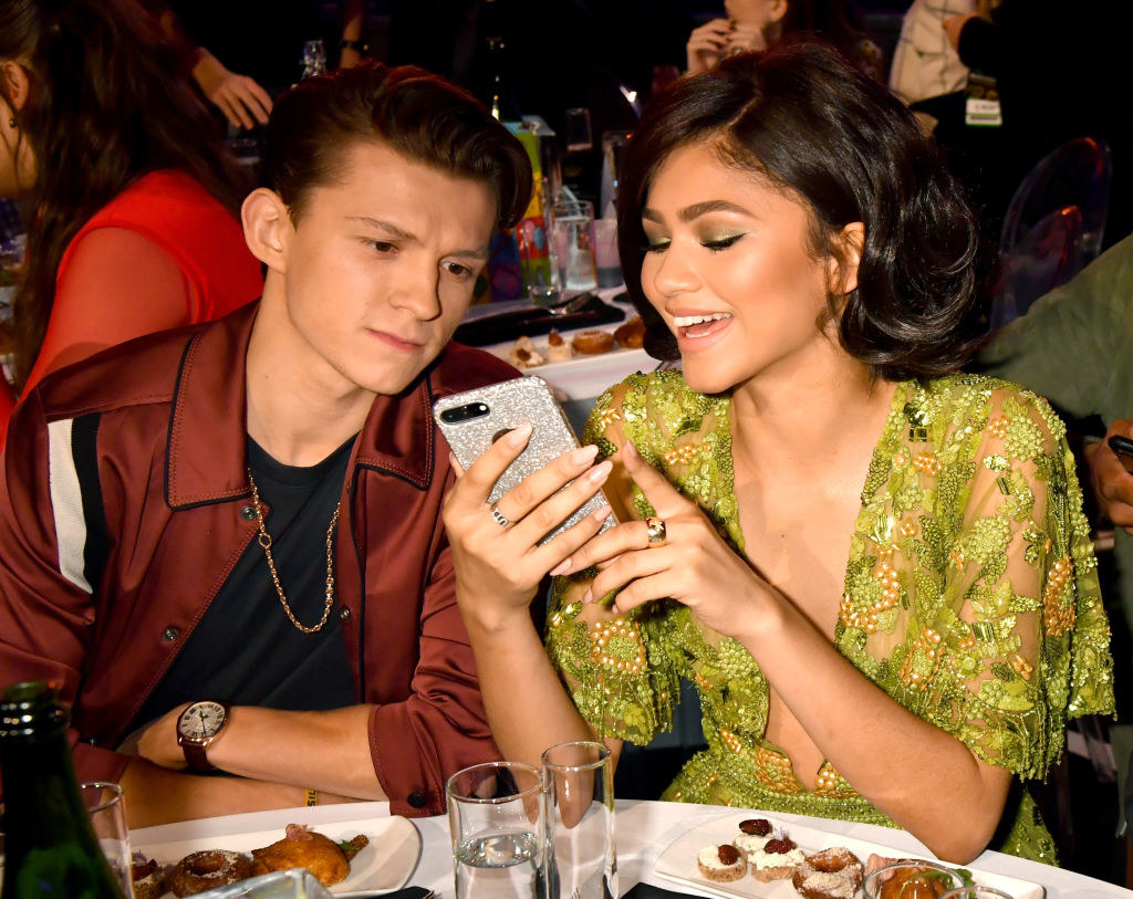 Tom Holland (L) and Zendaya at their dinner table at the 2017 MTV Movie And TV Awards