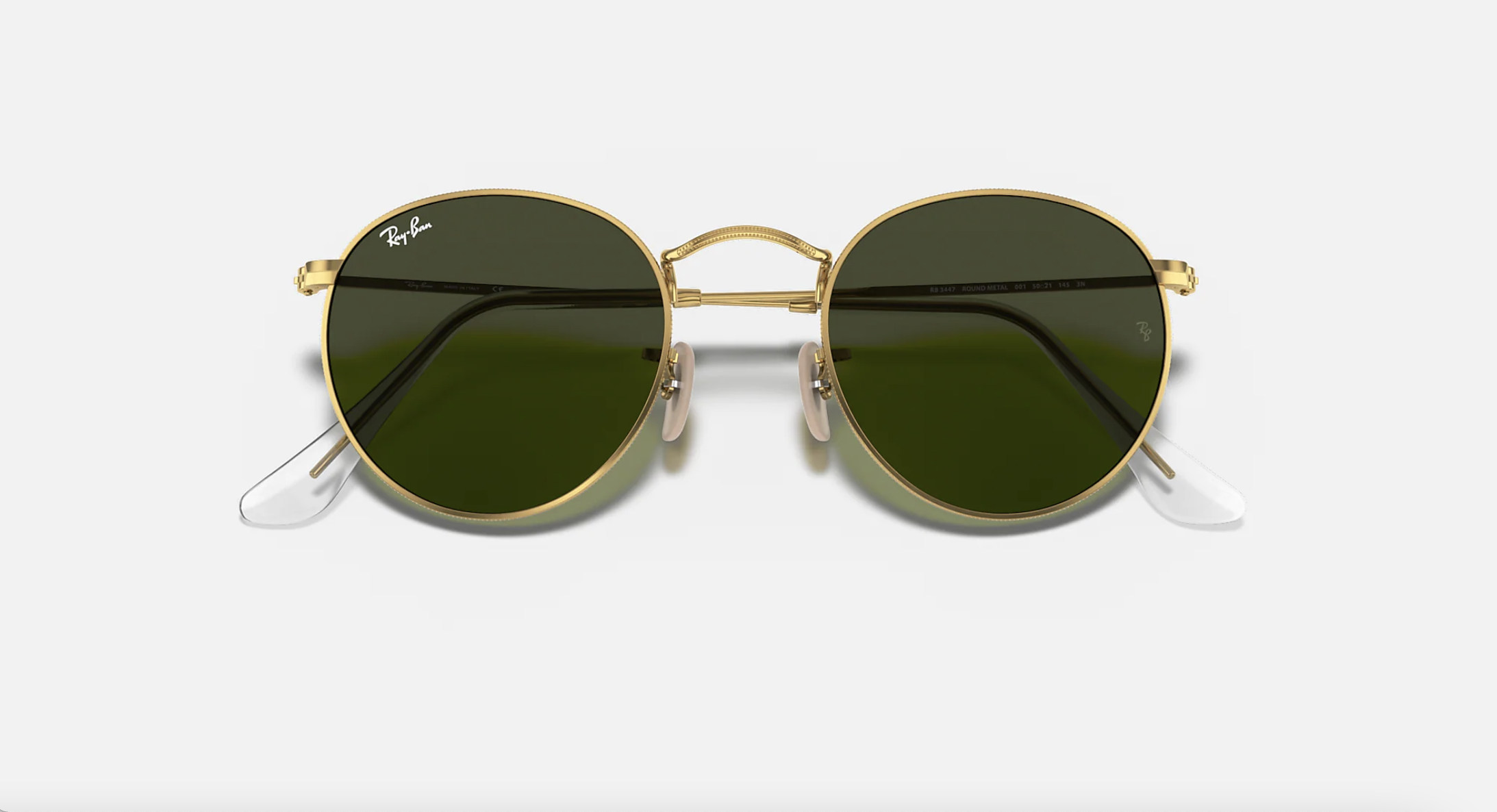 round grey sunglasses with gold frame