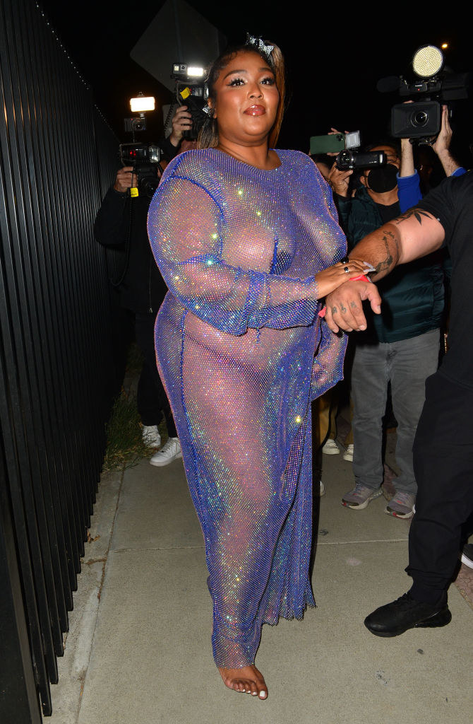Lizzo shows off her legs in sexy strapless minidress with stunning