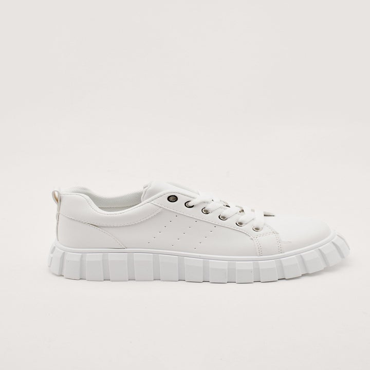 A side profile of the chunky sneakers in white