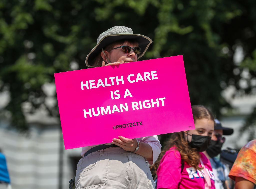 A protest sign that says &quot;healthcare is a human right&quot;