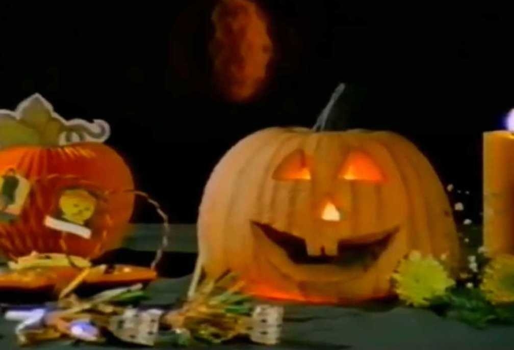 A jack-o-lantern puppet on a table