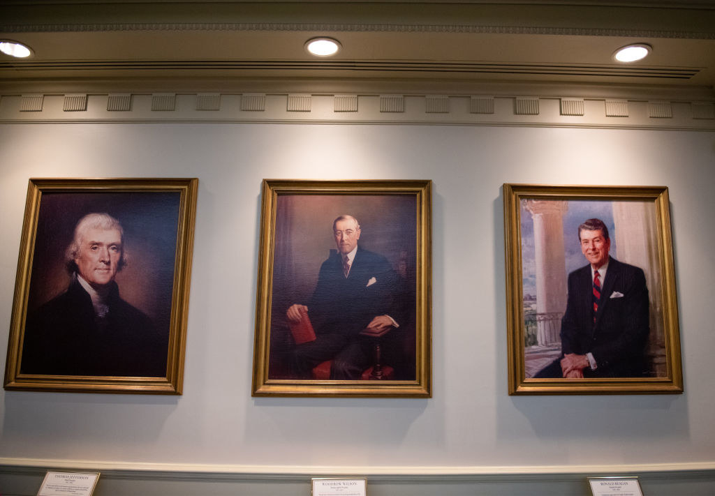 Three portraits of presidents in the Hall of Presidents