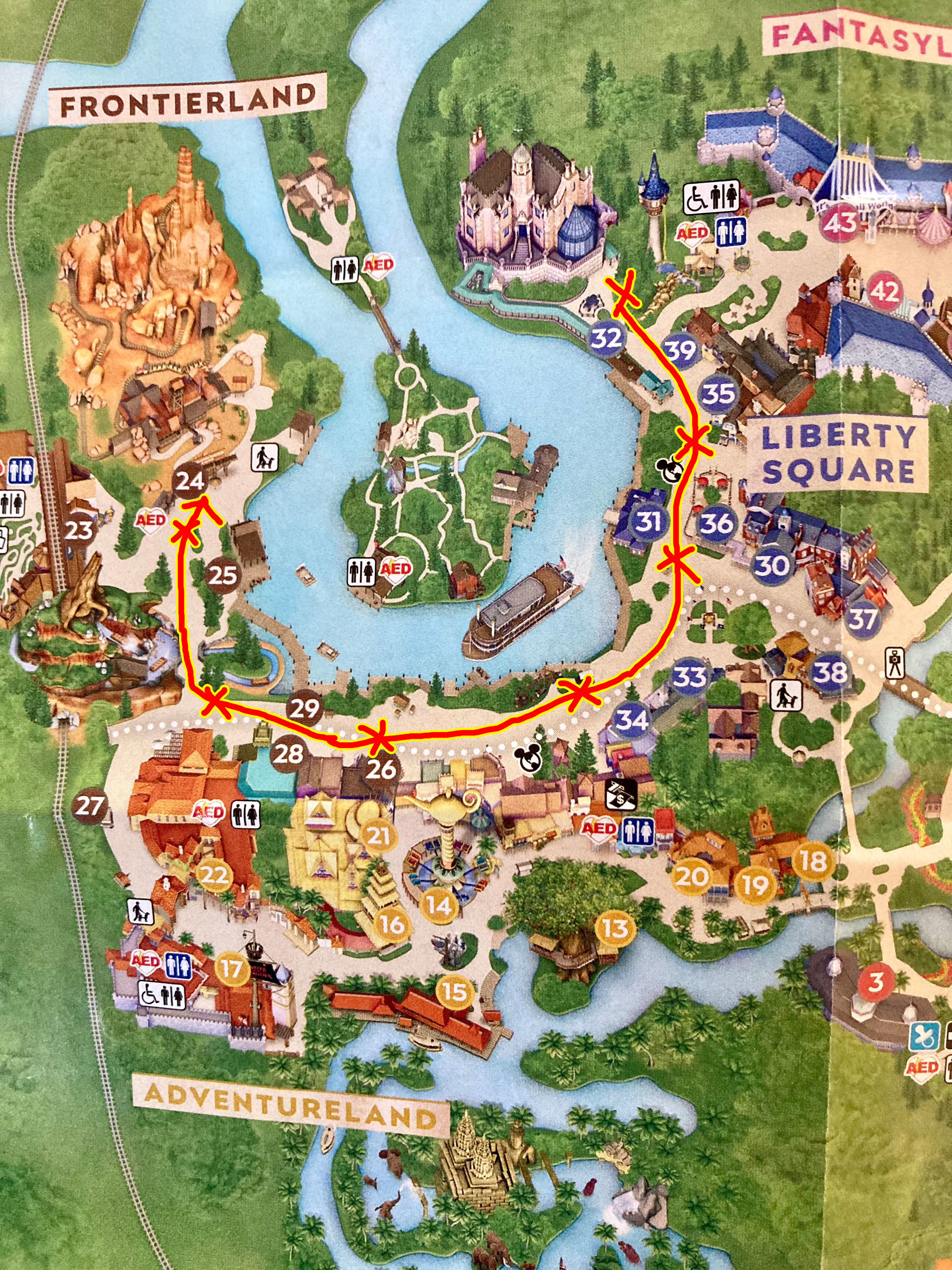 A map of the Magic Kingdom with an arrow traveling around the boardwalk between Liberty Square and Frontierland