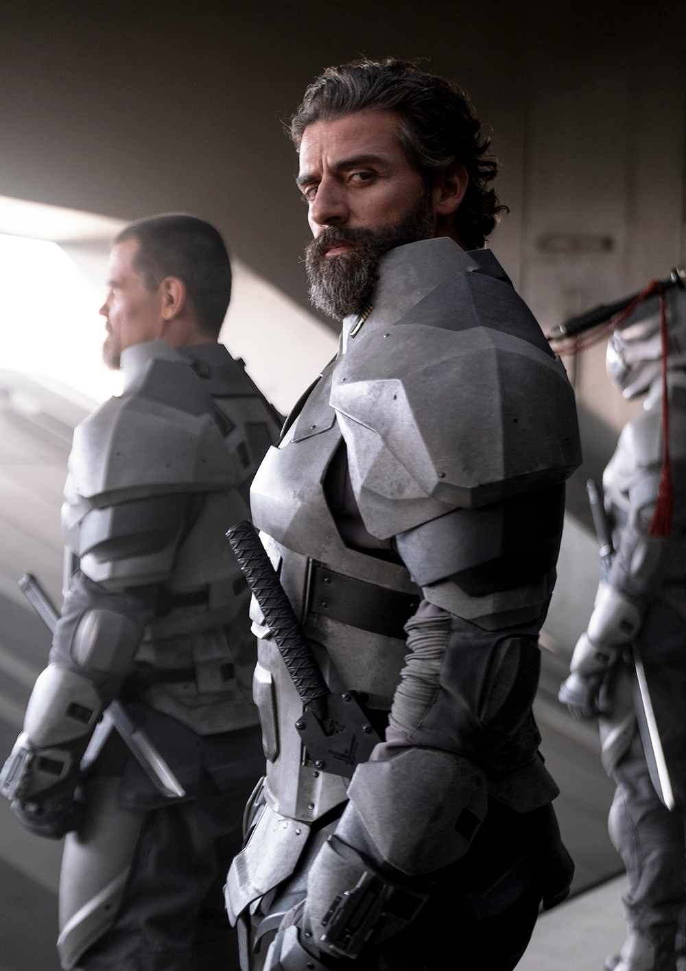 Oscar Isaac standing in sci-fi armor