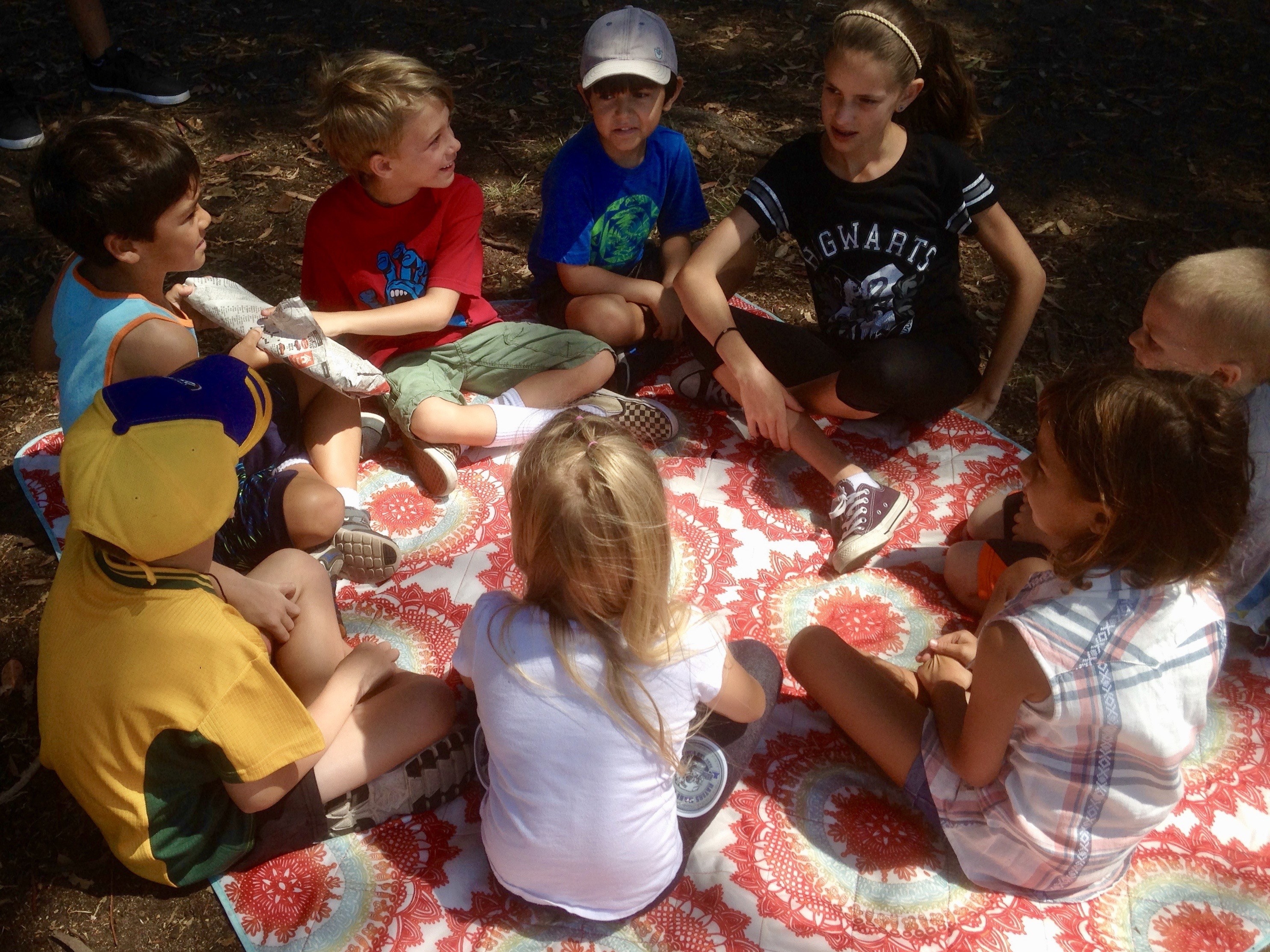 A group of children playing pass the parcel