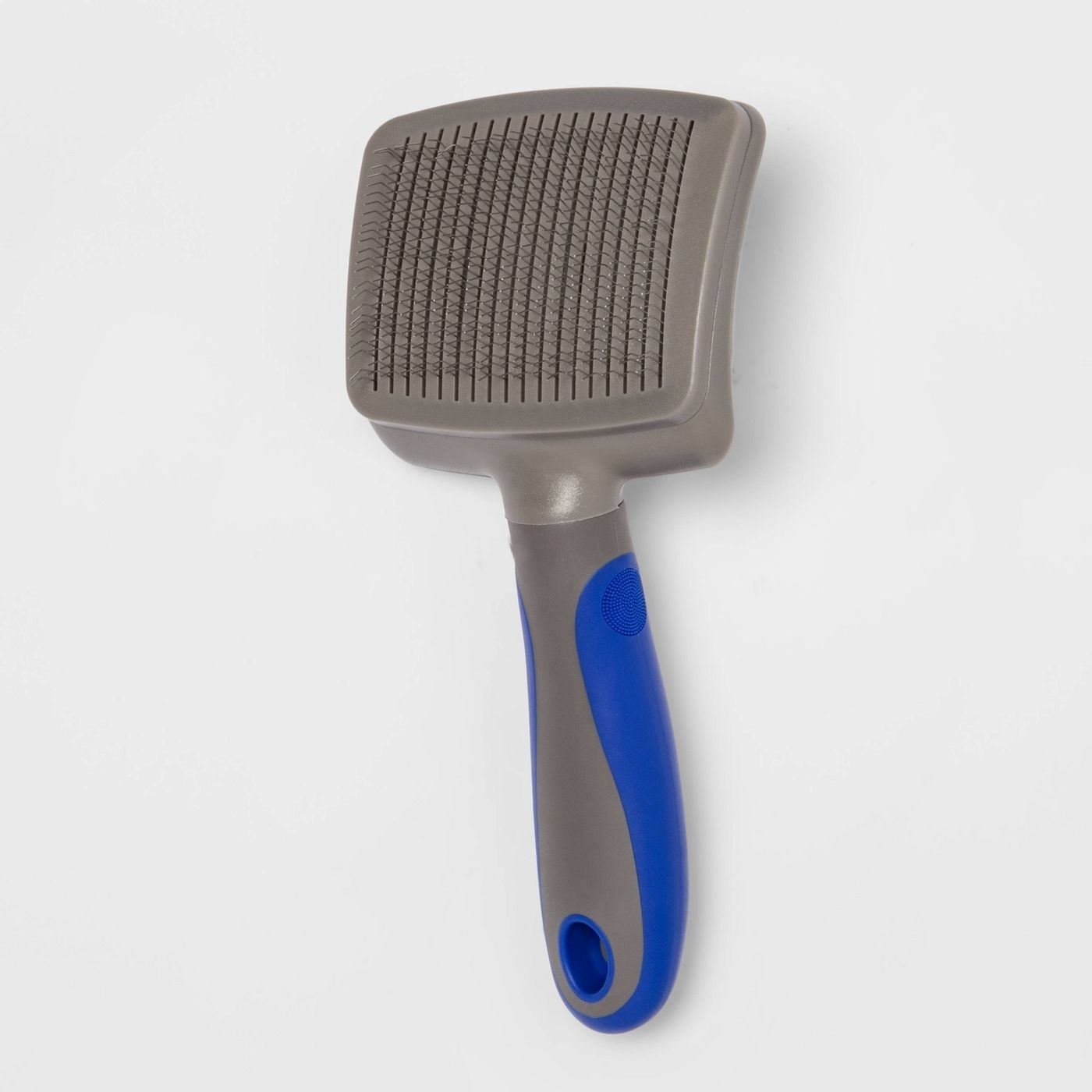 gray and blue dog grooming brush with steel tines