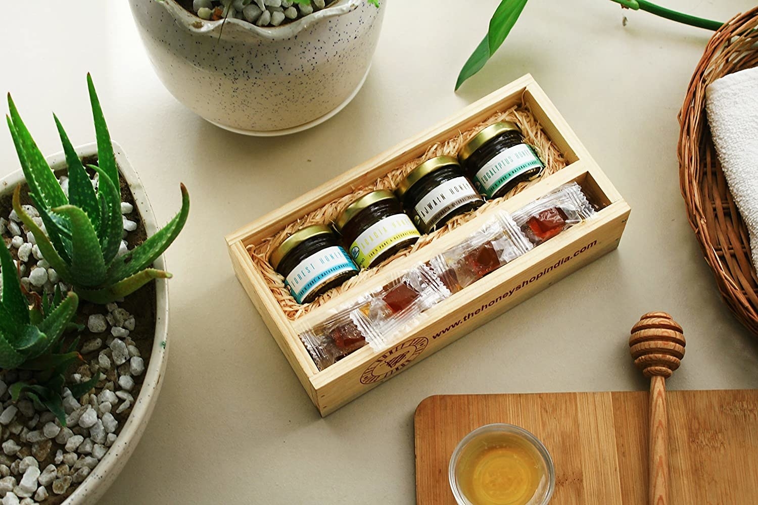 A box with assorted honey in jars and honey jellies
