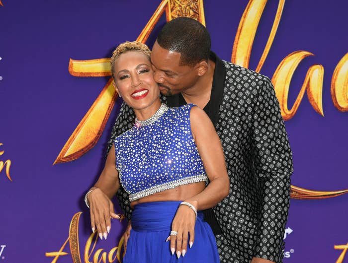 Will Smith and Jada Pinket-Smith canoodling at the Aladdin red carpet