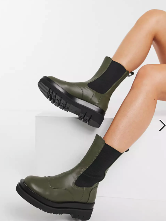The mid-calf boots being modeled in olive