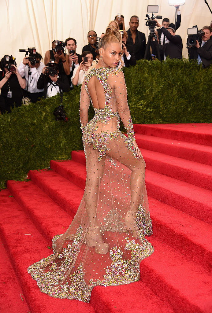 Beyoncé in a sheer dress, adorned with gemstones around a keyhole cutout on the back