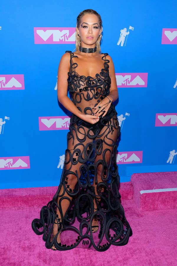 Rita in a sheer dress covered with a black squiggle effect