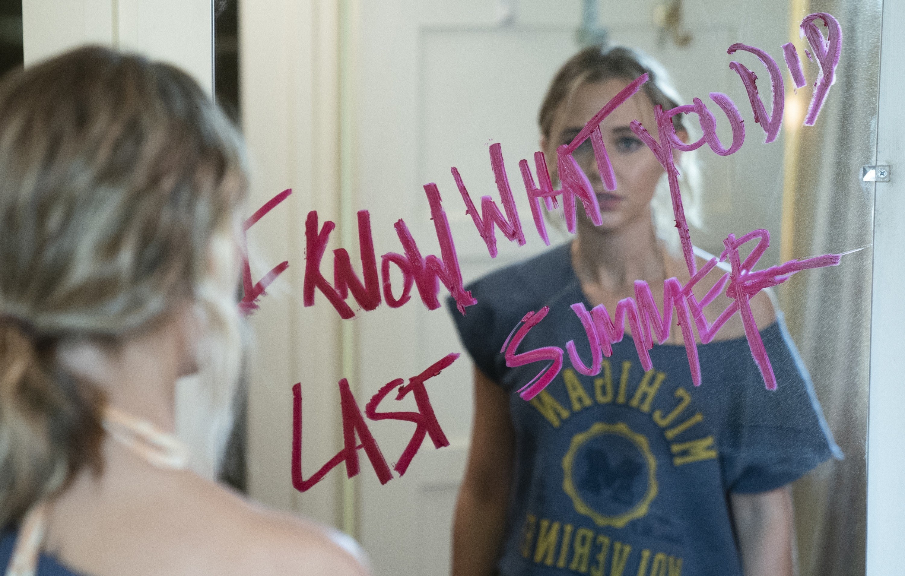 Madison Iseman looks into the mirror with &quot;I Know What You Did Last Summer&quot; written in lipstick