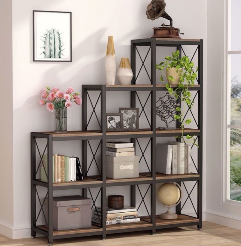 A rustic brown, industrial-style bookshelf with 9 cubes