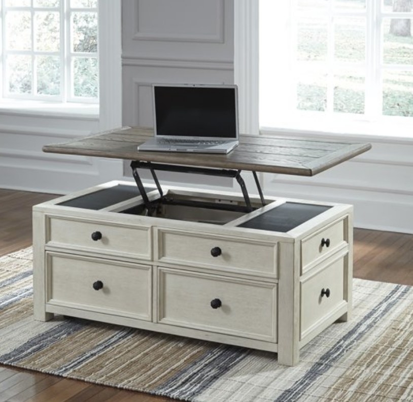 A cream, farmhouse-style, lift-top coffee table with 12 drawers