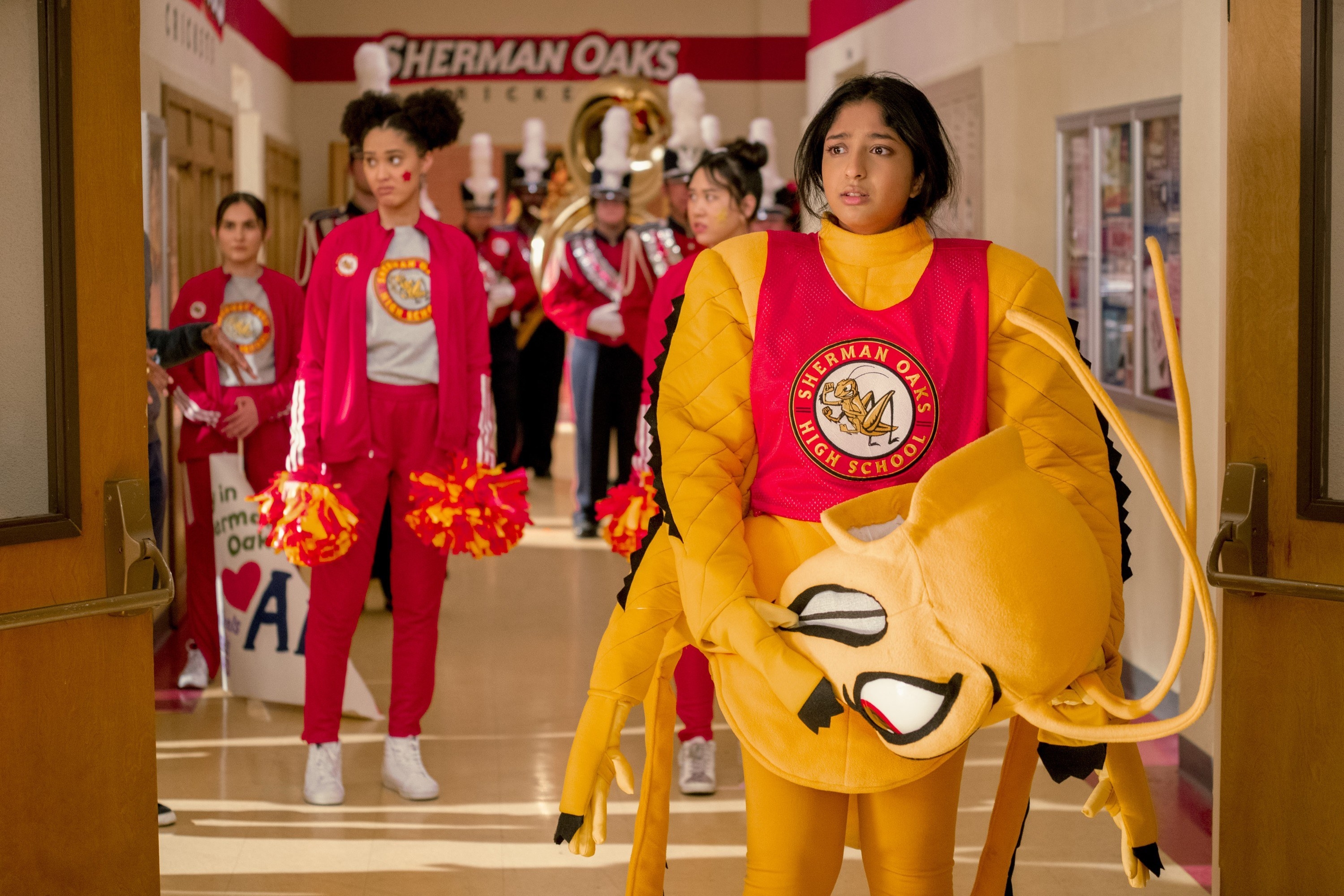 Maitreyi Ramakrishnan stands in a giant mascot costume