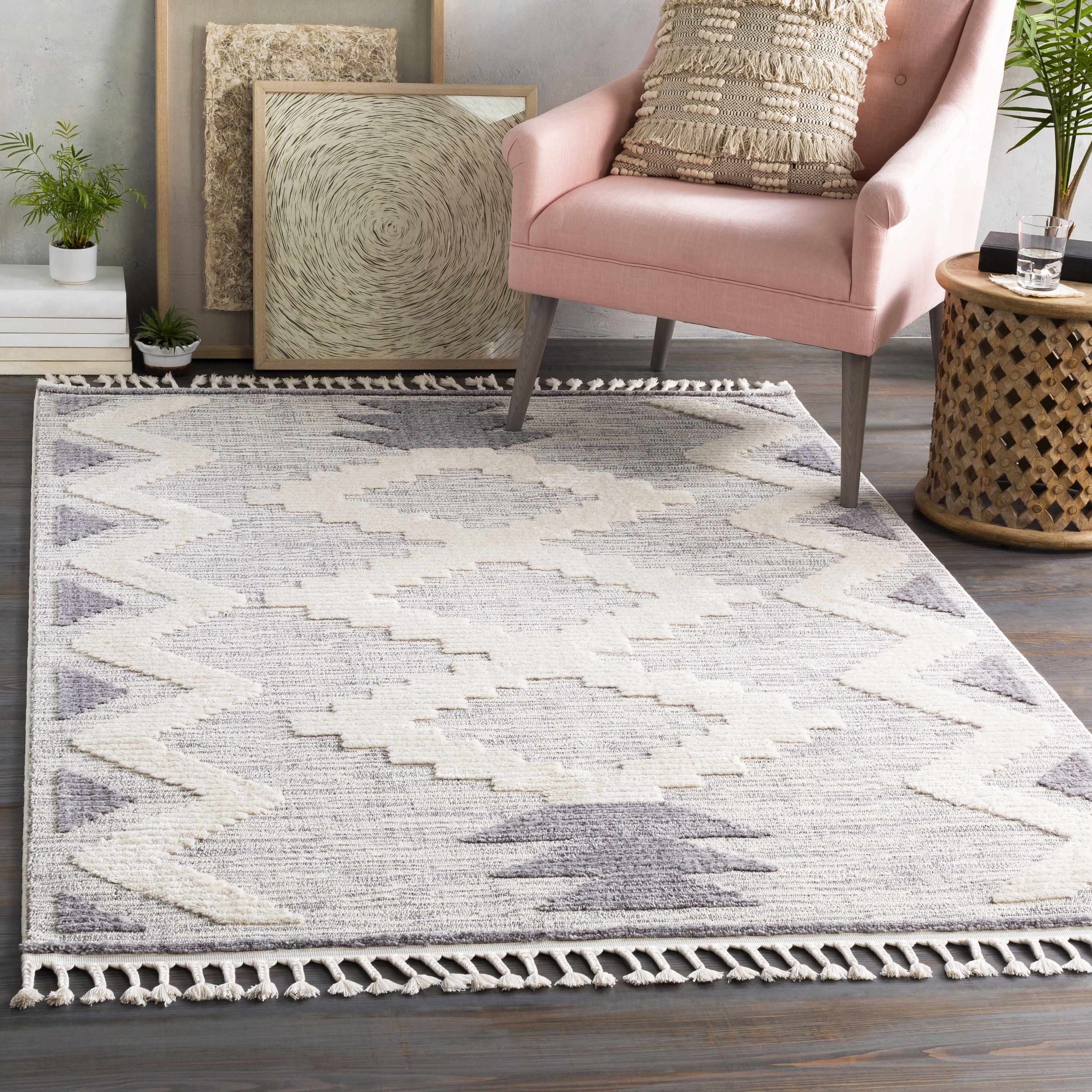 textured rug with tassels and a geometric design styled in living room