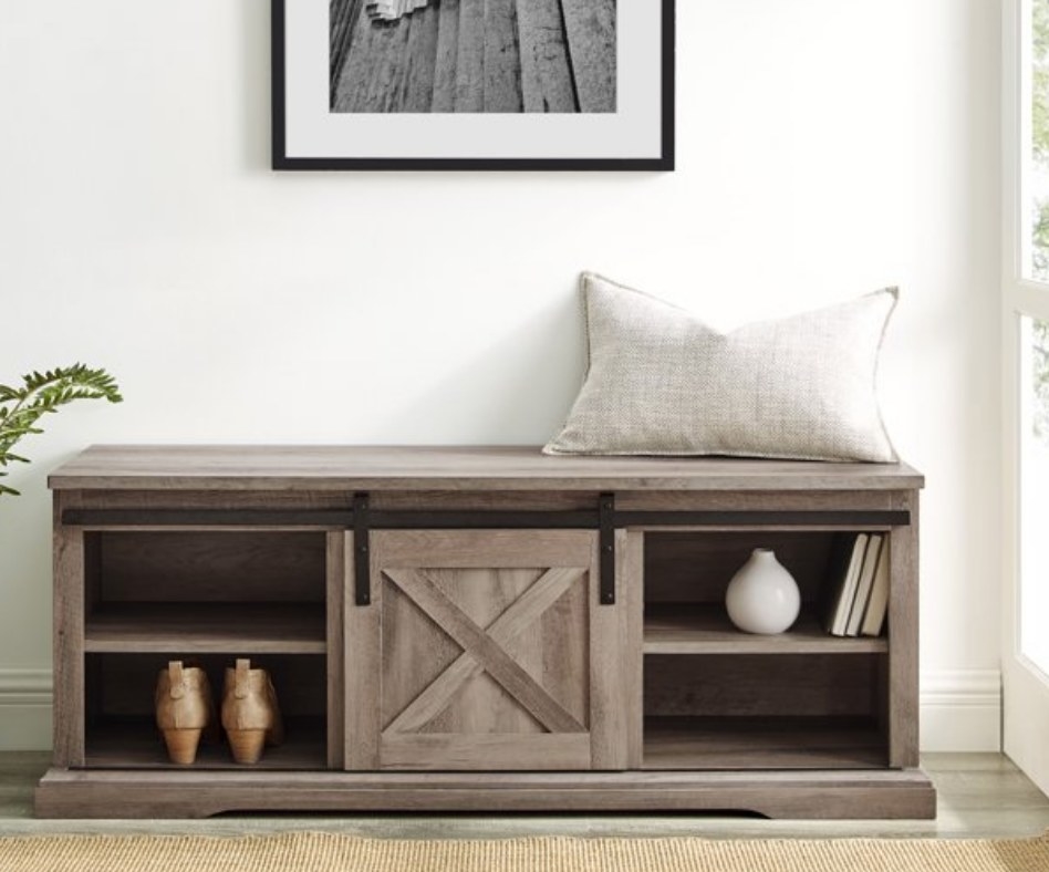 A grey wash, farmhouse-style storage bench with 4 adjustable shelves