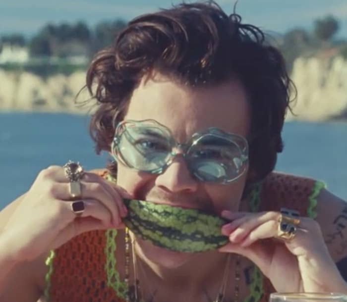 Harry Styles eating watermelon in his &quot;watermelon sugar&quot; music video