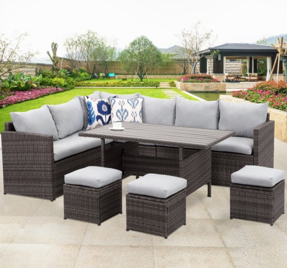 A 7pc, outdoor wicker patio set with grey cushions